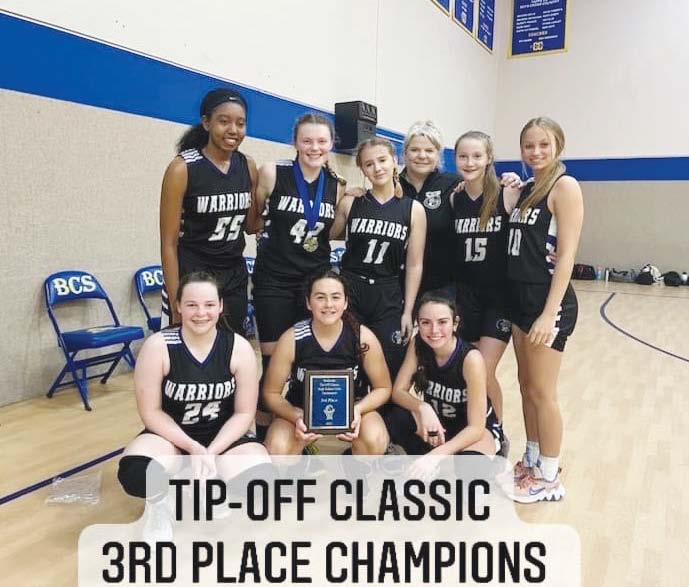 Lady Warriors pose for a photo with their plaque after taking 3rd place at the Tip-Off Classic in Fort Worth. Kayla Buchanan